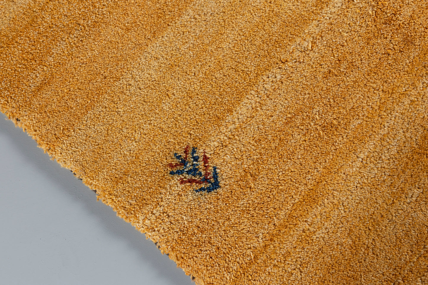 side of yellow rug 