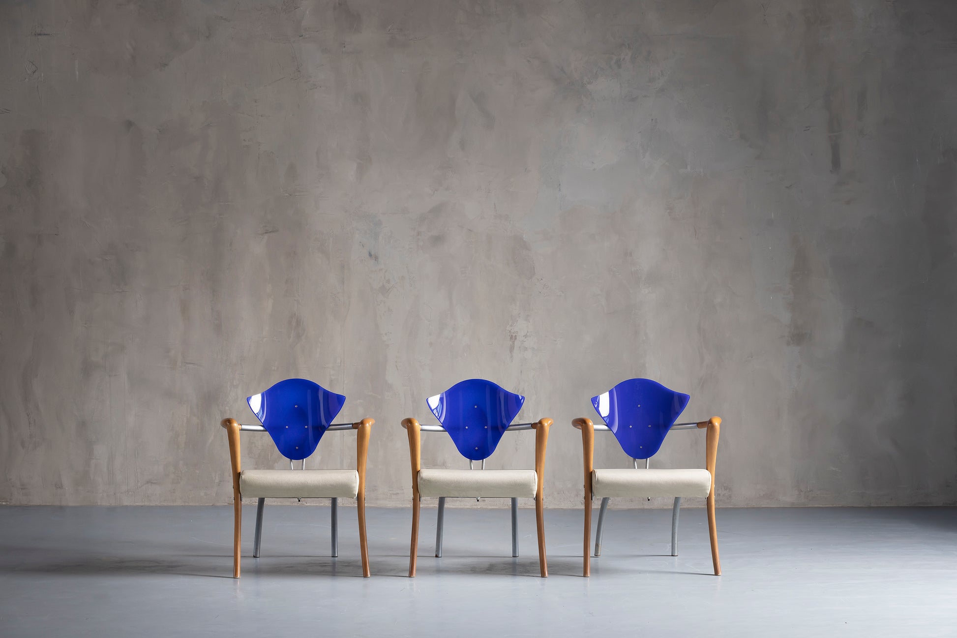 three beautiful blue chairs