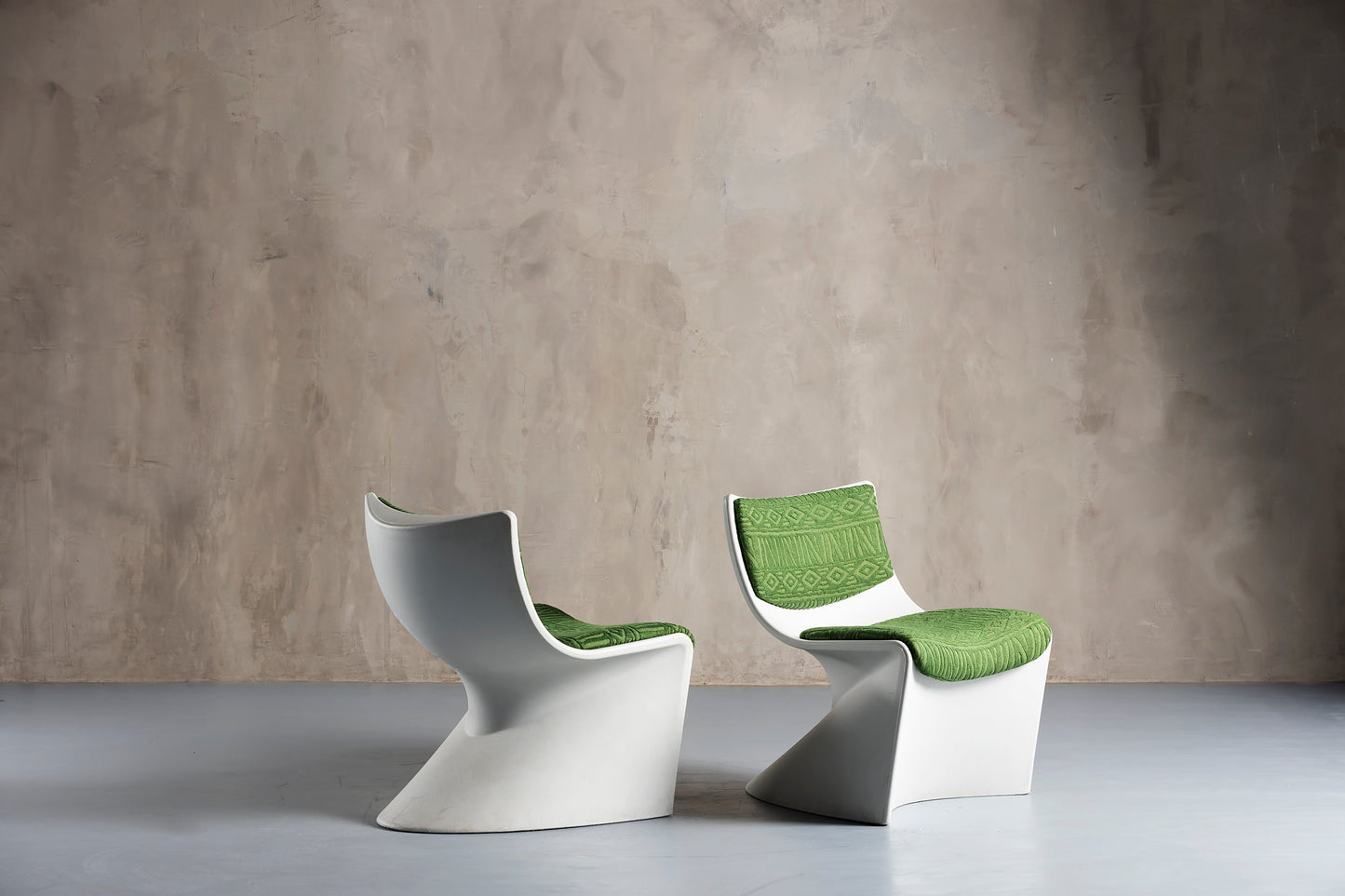 two white and green space design chairs
