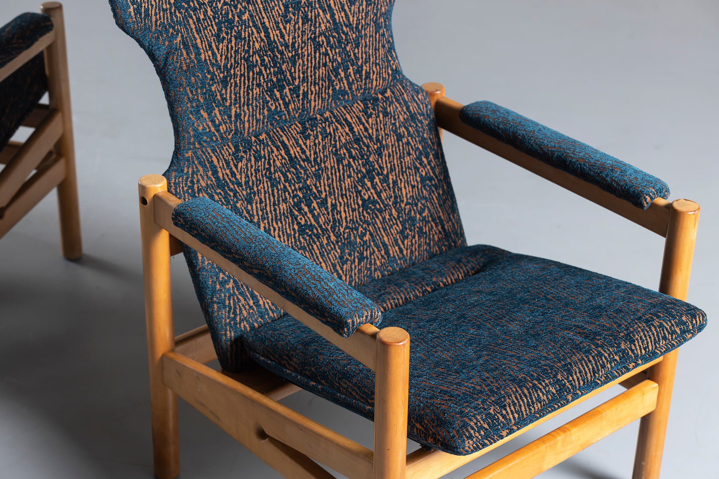 blue chair with wood trim, upclose