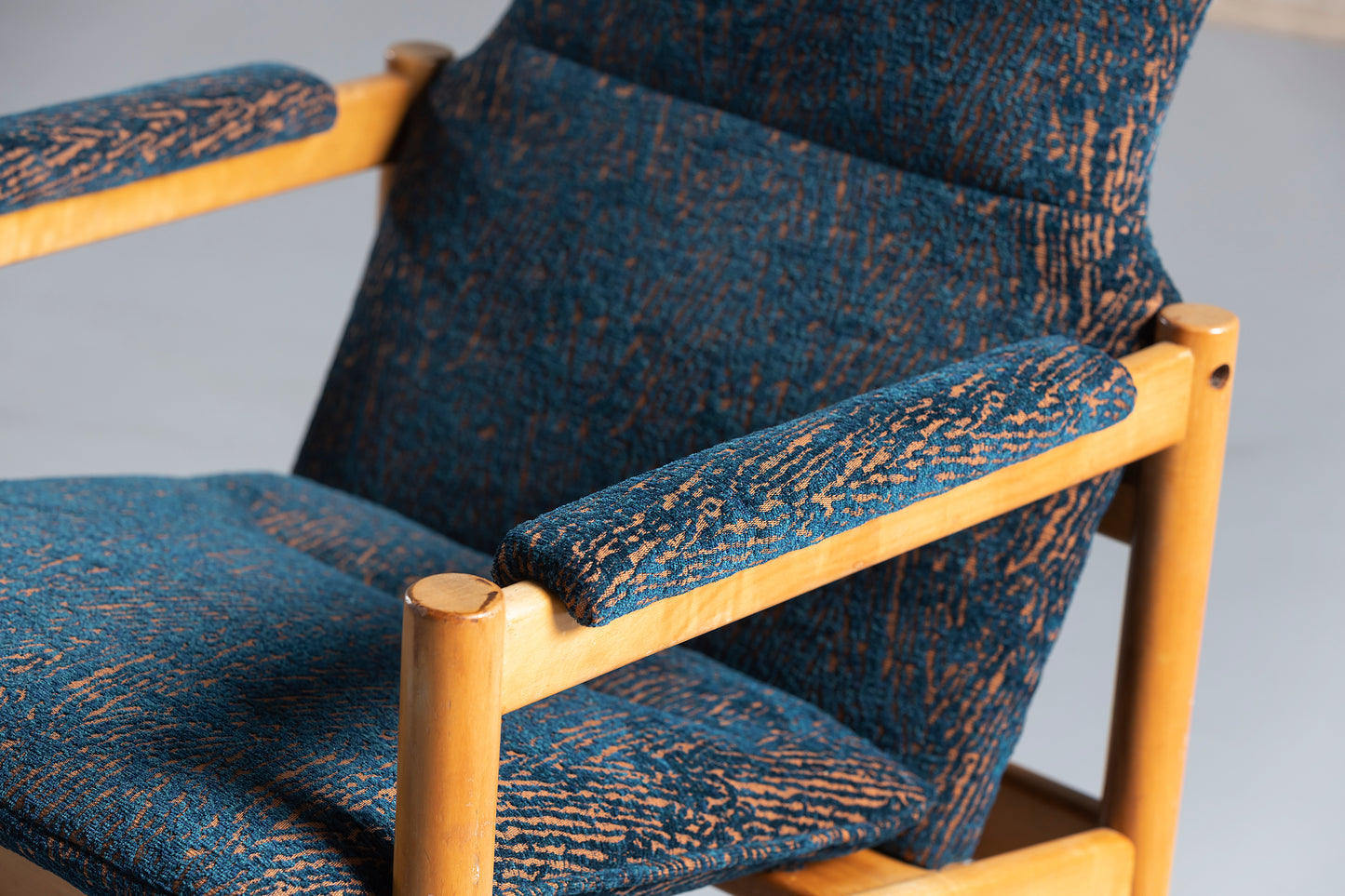 Blue chair armrest upclose