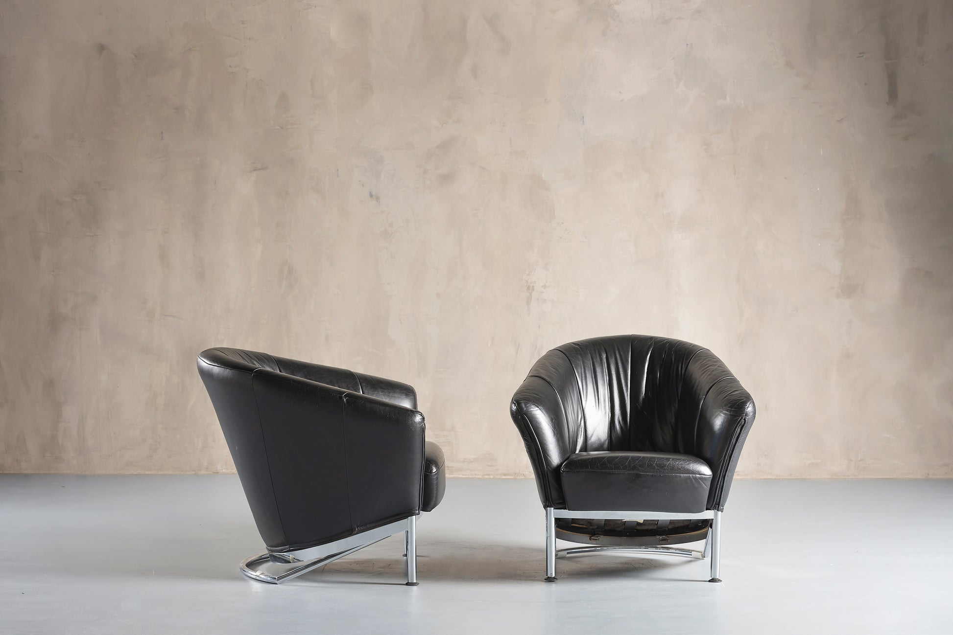 Two black leather chairs