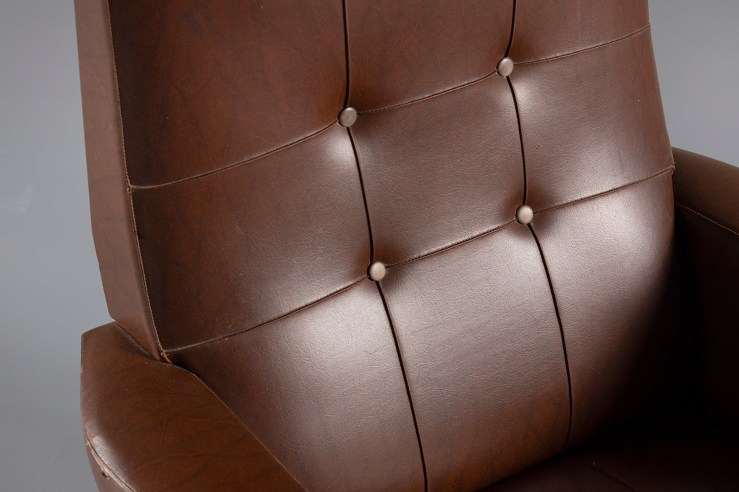 Brown leather armchair close up