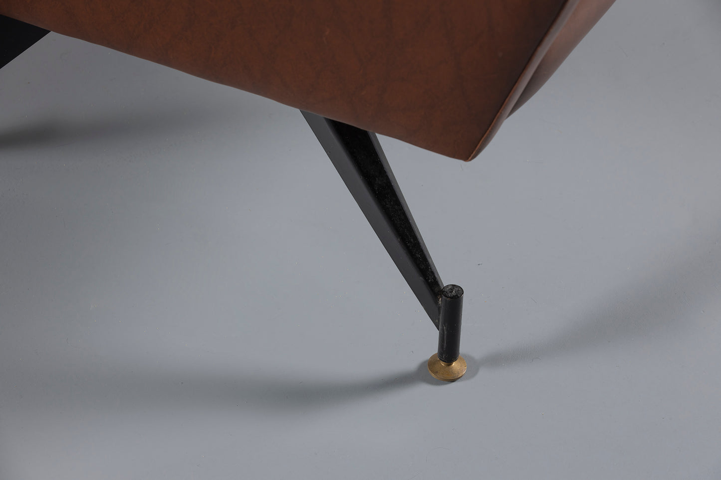 Legs of Brown leather armchair