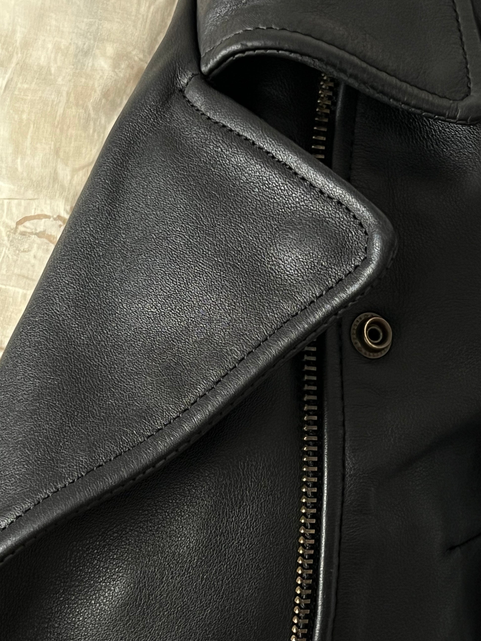 black woman’s leather jacket details