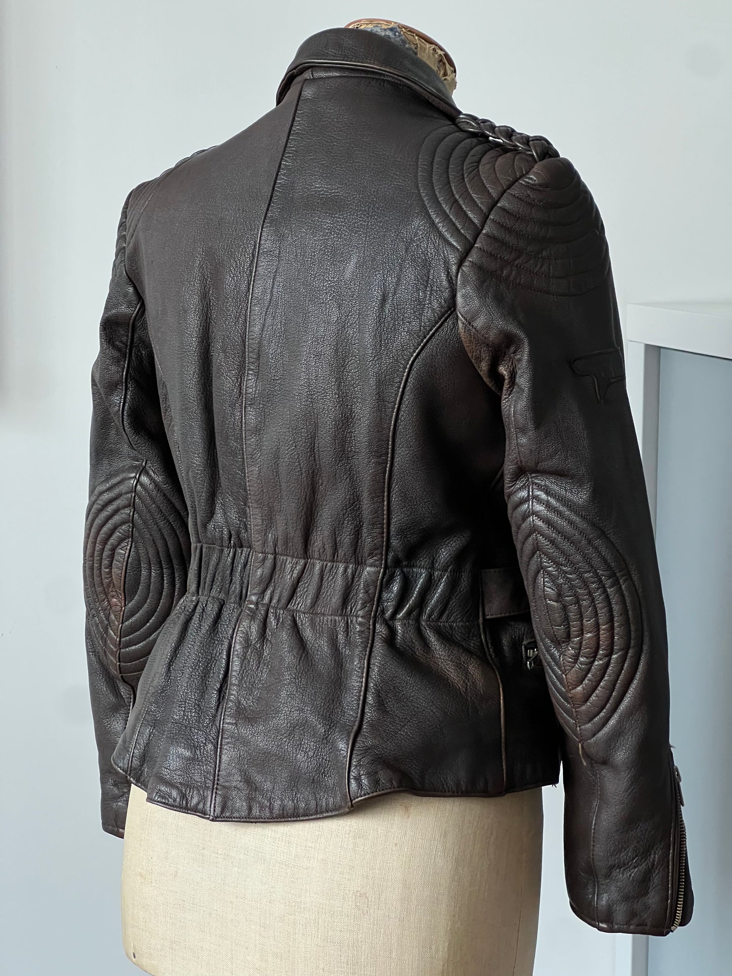 beautiful dark brown woman’s leather jacket backside