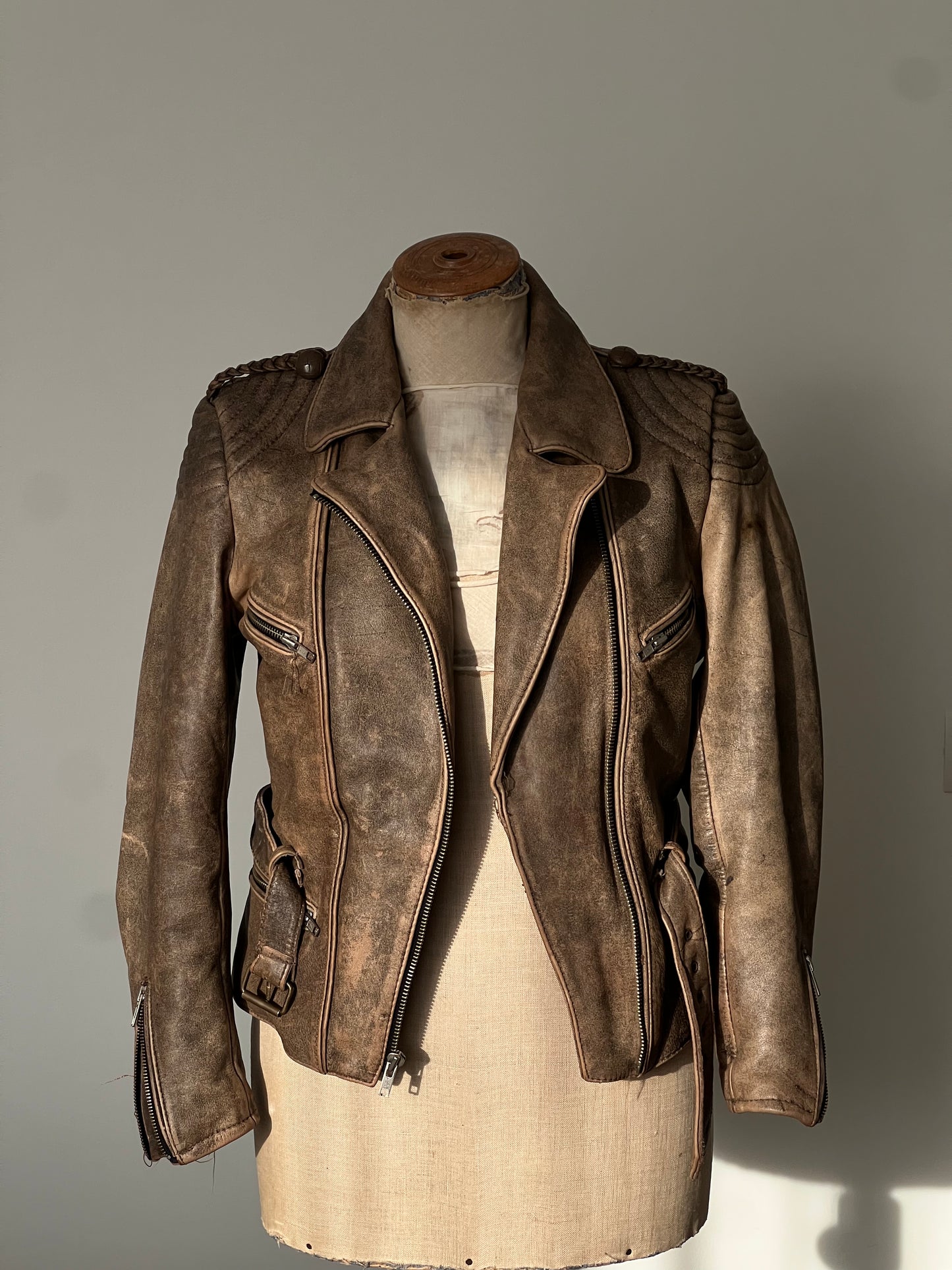 brown woman’s leather jacket