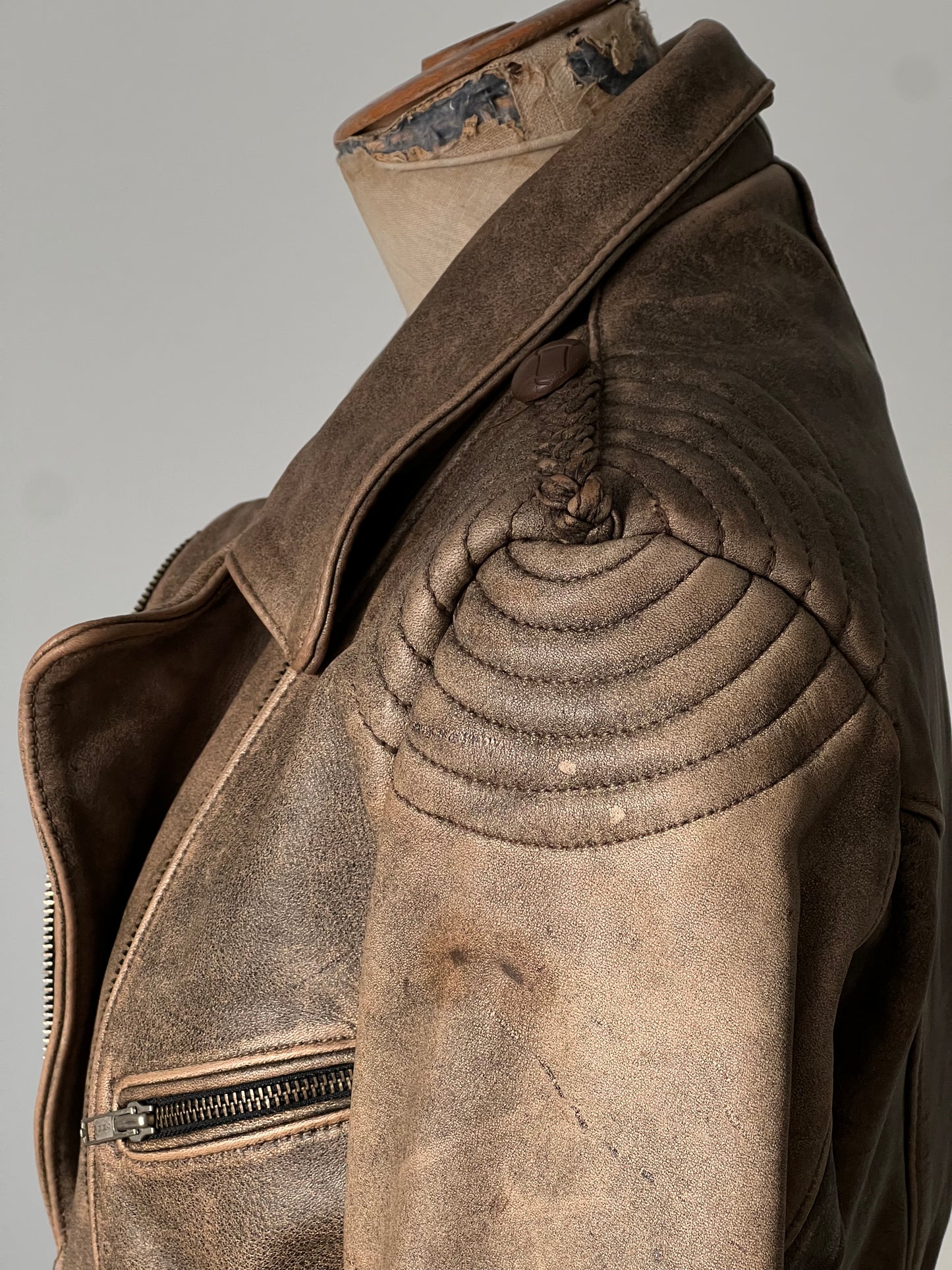brown woman’s leather jacket shoulder pad