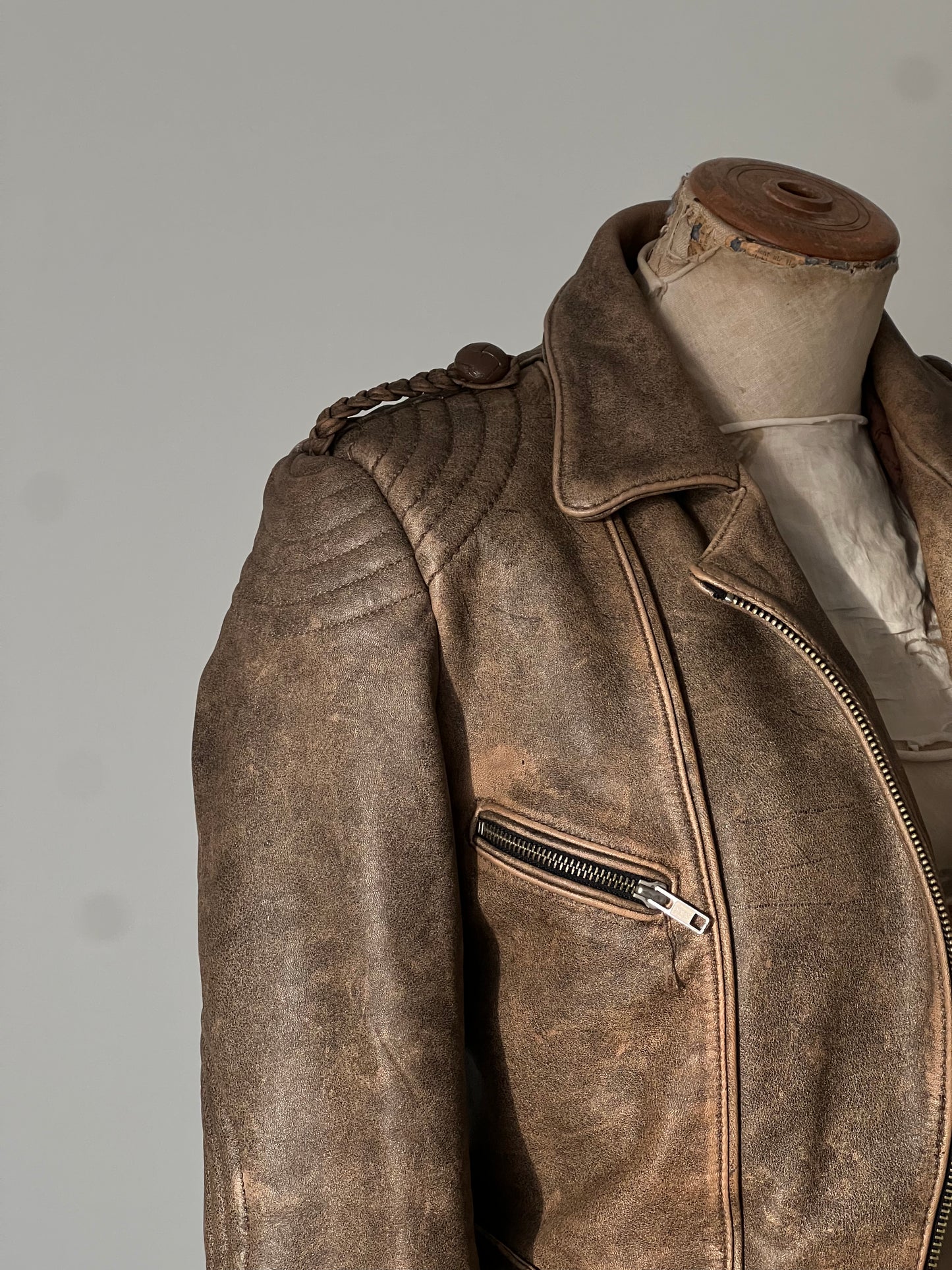 brown woman’s leather jacket shoulder