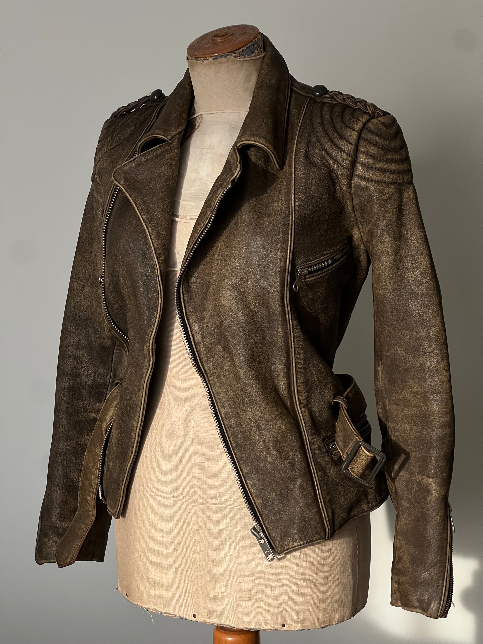 beautiful brown woman’s leather jacket on a mannequin