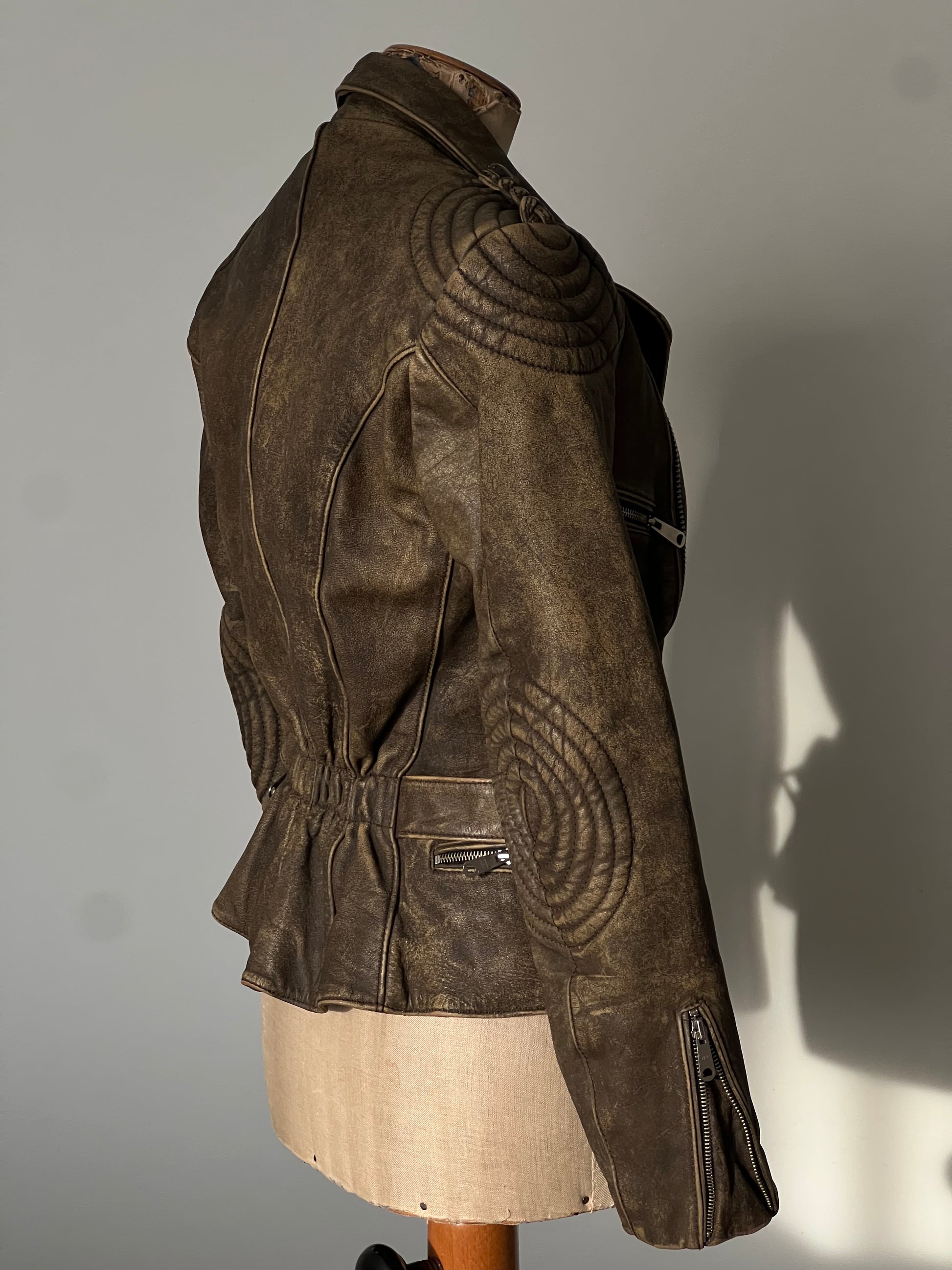 beautiful brown woman’s leather jacket profile