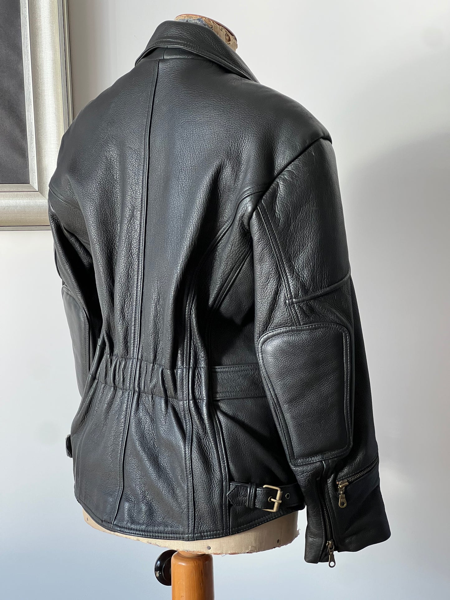 black woman’s leather jacket profile