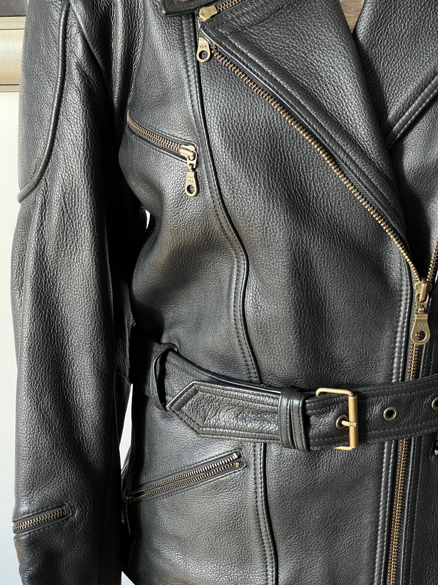 black woman’s leather jacket belt