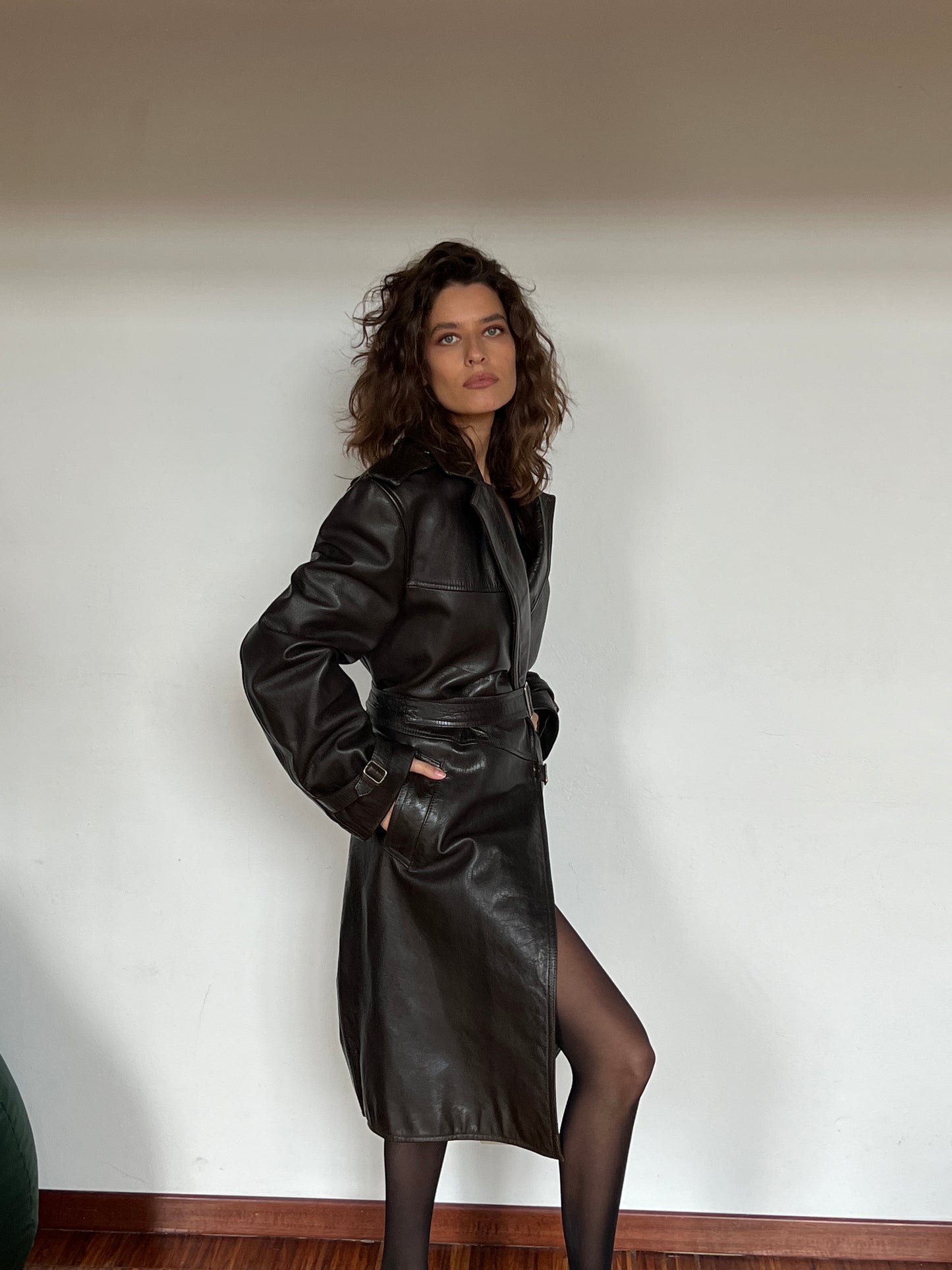 woman wearing black leather trench coat