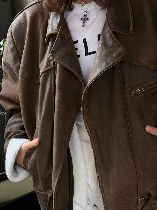 woman wearing a brown woman’s bike leather jacket