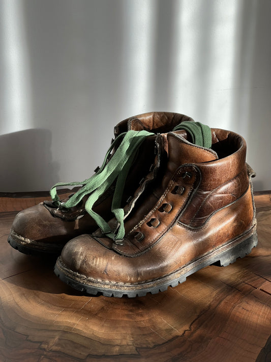 dark brown women’s leather hiking boots with green shoelaces from the side